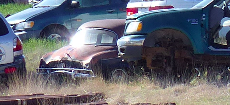 Illustration for article titled Help Us Spot the Incredible Cars in This Kansas Junkyard